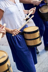 Fototapeta na wymiar Citizens drumming in Tamborrada, the drum parade to commemorate the day that allied Anglo-Portuguese troops invaded the city. Basque Country, Guipuzcoa. Spain.
