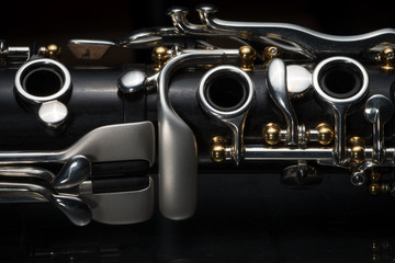 Fototapeta premium Details of a clarinet with silver keys and golden sockets