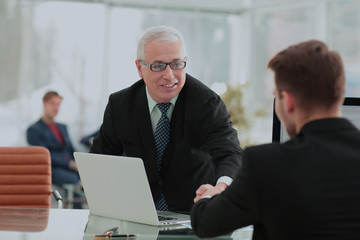 Businessman by handshake invites to cooperation.