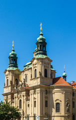 Fototapeta na wymiar Prague: St. Nicholas church and Jan Hus memorial