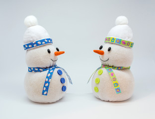 Photo of snowmans isolated on neutral background