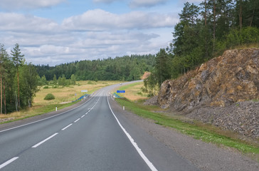 The summer landscape is a motorway in the middle of northern nature. Federal highway A-121 "Sortavala" in Karelia