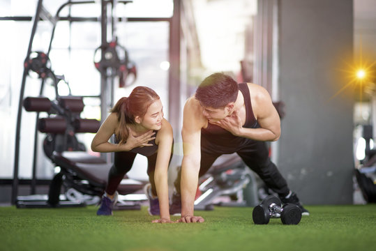 Couple lover enjoy excercise together in gymnasium for a strong mild and health living further