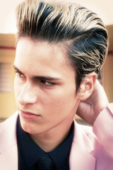 Close-up of a very handsome boy with toupee