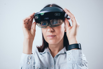 Woman wearing augmented reality goggles.