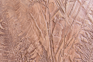 relief decorative plaster with an imprint of various plants