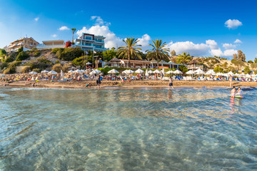 Undefinable People relaxing on Coral Bay Beach, one of the most famous beaches in Cyprus.