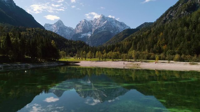 Jasna Lake aerial view showing reflection of mountain peaks