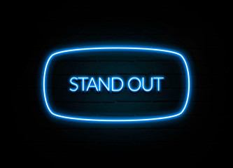 Stand Out  - colorful Neon Sign on brickwall
