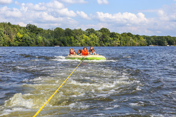 People tubing on an inland lake
