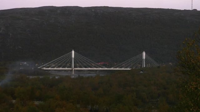 White bridge, Time lapse of the border bridge between norway and utsjoki town, on a sunny autumn evening dawn, Lapland, Lappi, Finland