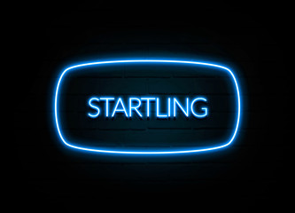 Startling  - colorful Neon Sign on brickwall