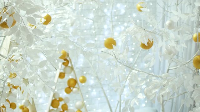 New Year decor in white colors. Balls like oranges on snow-white trees. The video is suitable for the background