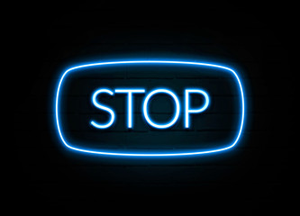 Stop  - colorful Neon Sign on brickwall