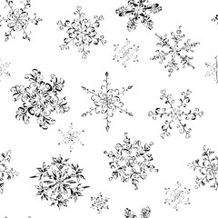 Seamless pattern of hand-drawn black-and-white snowflake 