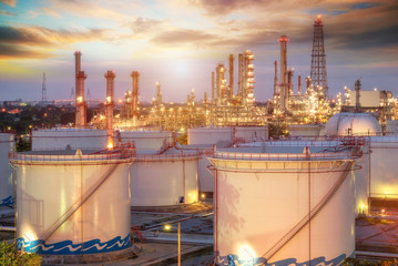Refinery at sunset and oil thank petrochemical plant