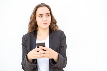Fototapeta premium Concentrated female manager thinking of message