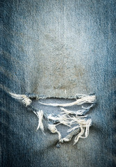 torn old blue jeans texture background