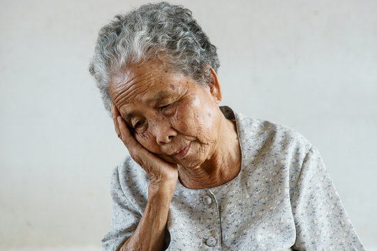 Senior asian woman was headache