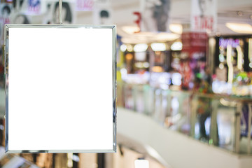Blank billboard advertising hanging in shopping mall sale blurred background ,commercial, marketing and advertisement concept