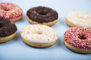 Obraz na płótnie Canvas Multicolored donuts close-up