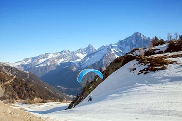 Poster A paraglider takes off in Chamonix valley © anrymos
