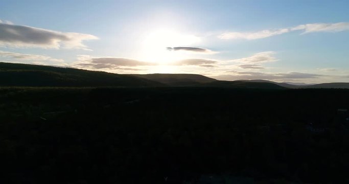 Autumn river, Cinema 4k aerial 360 degree view over tenojoki river at the border between norway and utsjoki town, on a sunny autumn day, in utsjoki, Lapland, Lappi, Finland
