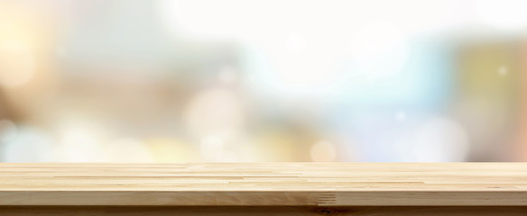 Wooden table top against cafe background