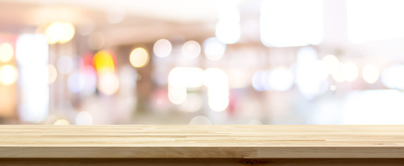 Wooden table top against cafe background