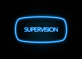 Supervision  - colorful Neon Sign on brickwall