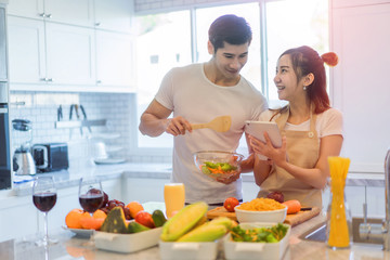 couple lover enjoy together cooking in home kitchen, joining prepare food together for extent relationship last longer concept