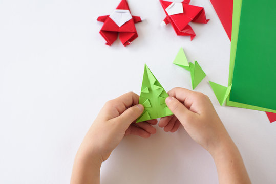 Lesson of origami. Santa Claus of origami a fir-tree of origami from paper 