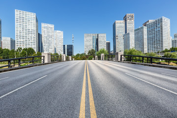 Asphalt road and urban commercial building scenery