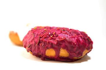 Obraz premium donut covered with red glaze side view on white background