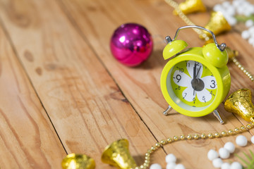 Christmas background with  alarm clock and pink ball