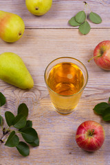 Cider on rustic wooden background with apples and pears, vertical