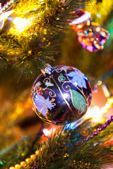 Ball with a pattern weighs on tree closeup