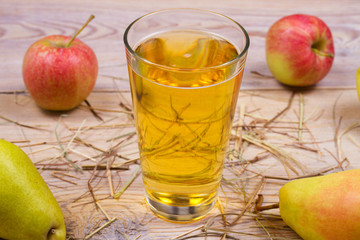 Cider on rustic wooden background with apples and pears, vhorizontal