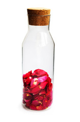 rose petals in the crystal vase on white