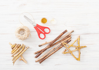 Crafts from the branches of the star and tree on white table