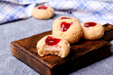 Cookies with jam, biscuits on a brown desk