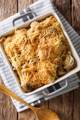 Chicken tetrazzini from spaghetti, mushrooms, cheese and cream sauce close-up. Vertical top view © FomaA