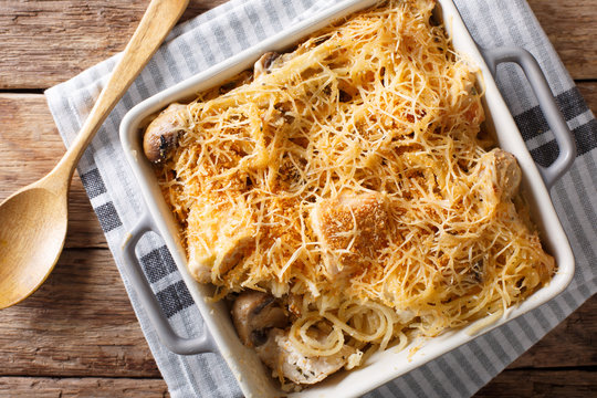 Chicken tetrazzini from spaghetti, mushrooms, cheese and cream sauce close-up. horizontal top view