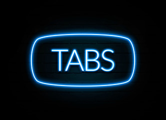 Tabs  - colorful Neon Sign on brickwall