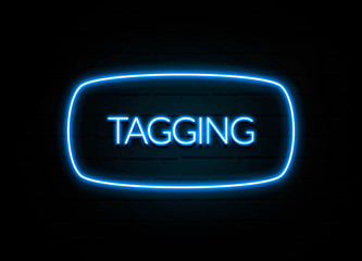 Tagging  - colorful Neon Sign on brickwall