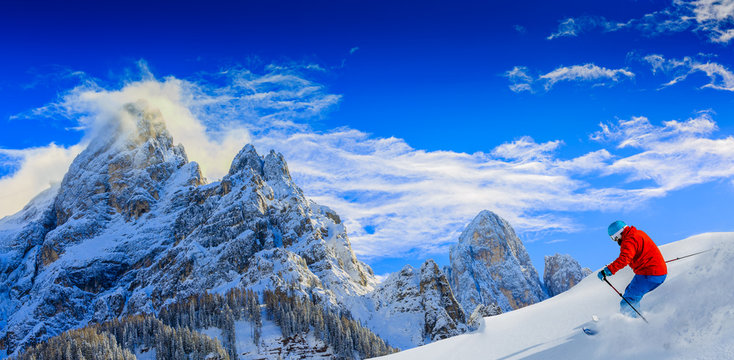 Skiing with amazing panorama of Pale di Sant Martino di Castrozza, Dolomites mountain, Italy
