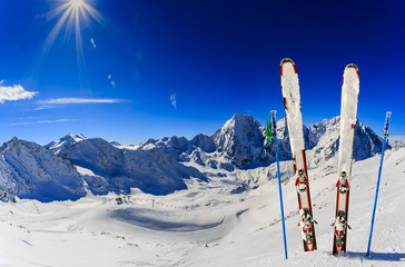 Ski in winter season, mountains and ski touring backcountry equipments on the top of snowy...