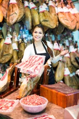 Fotobehang butcher with lard and meat in counter of store © JackF
