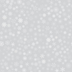 seamless pattern from white snowflakes on the grey background. Texture for cards, greeting, Christmas, new year, holiday, party