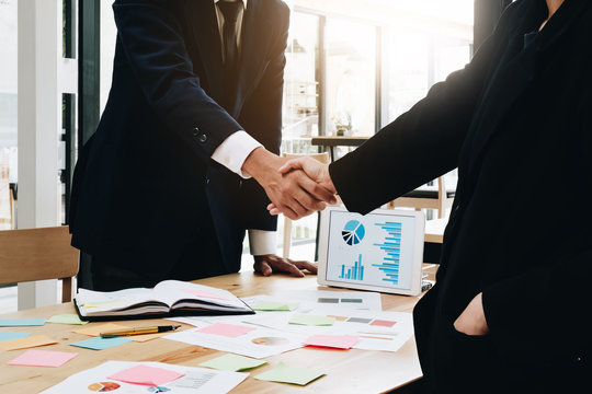 Close up of Business people shaking hands, finishing up meeting, business etiquette, congratulation, merger and acquisition concept